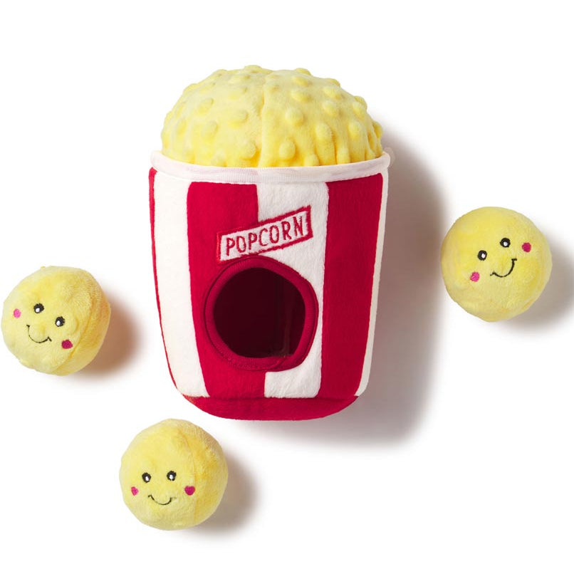 Popcorn-themed toy with three small round toys on a white background Keep your pup entertained with the Zippy Burrow® Popcorn Bucket! This interactive toy promotes mental stimulation through hide-and-seek play with squeaky popcorn balls.