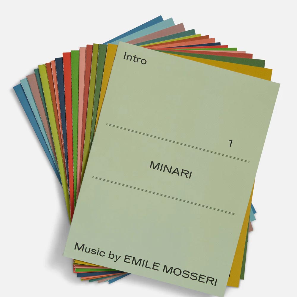 Colorful booklets with 'Minari' and 'Emile Mosseri' text on a white background