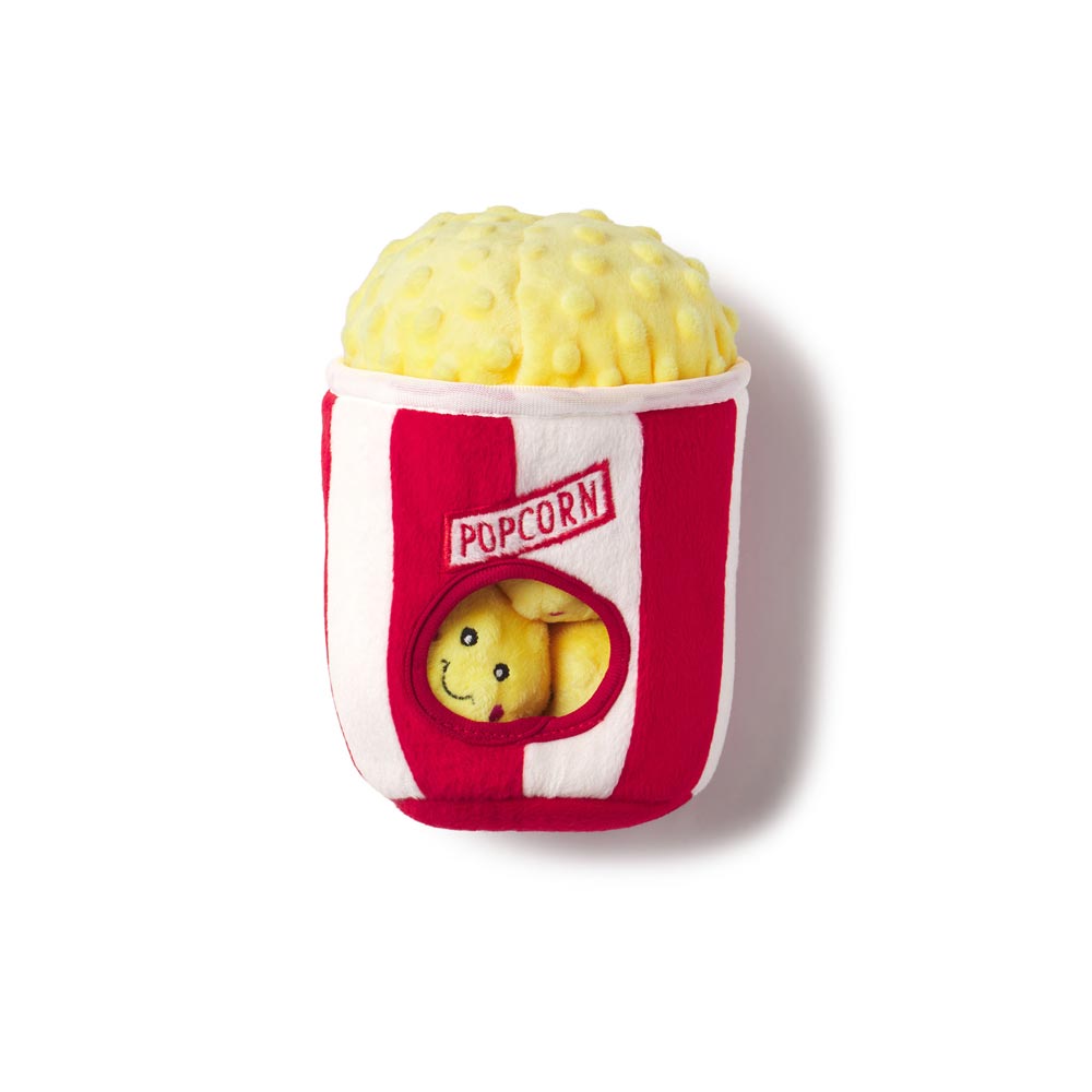 Plush toy resembling a popcorn container with a smiling face peeking out on a white background