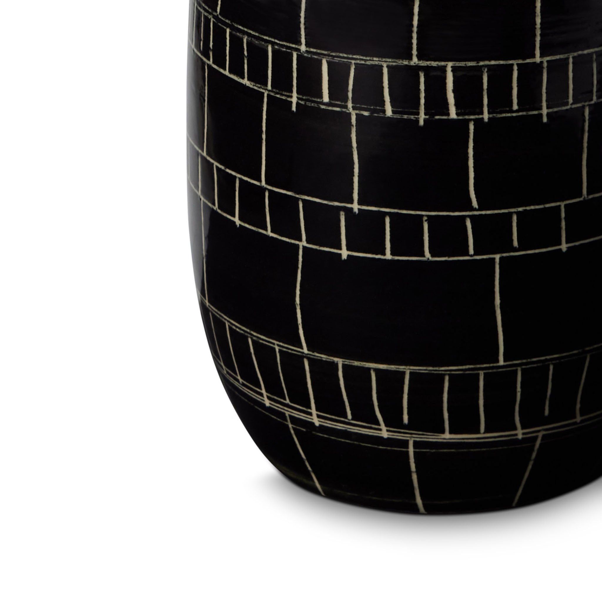 Black cylindrical vase with white line pattern on a white background Black mosaic vase on a white background by ceramicist Wayne Perry in Los Angeles