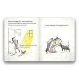 Open book with illustrations of a girl and her cat, featuring text about their relationship.