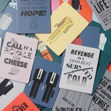 Collection of colorful cards with various designs and text on a multicolored background