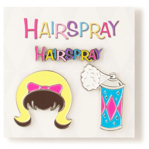 Two enamel pins on a card with 'Hairspray' text, one featuring a character with a bow and the other a can of hairspray. inspired by the John Waters movie HAIRSPRAY (1988)