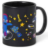 Black mug with colorful designs on a white background