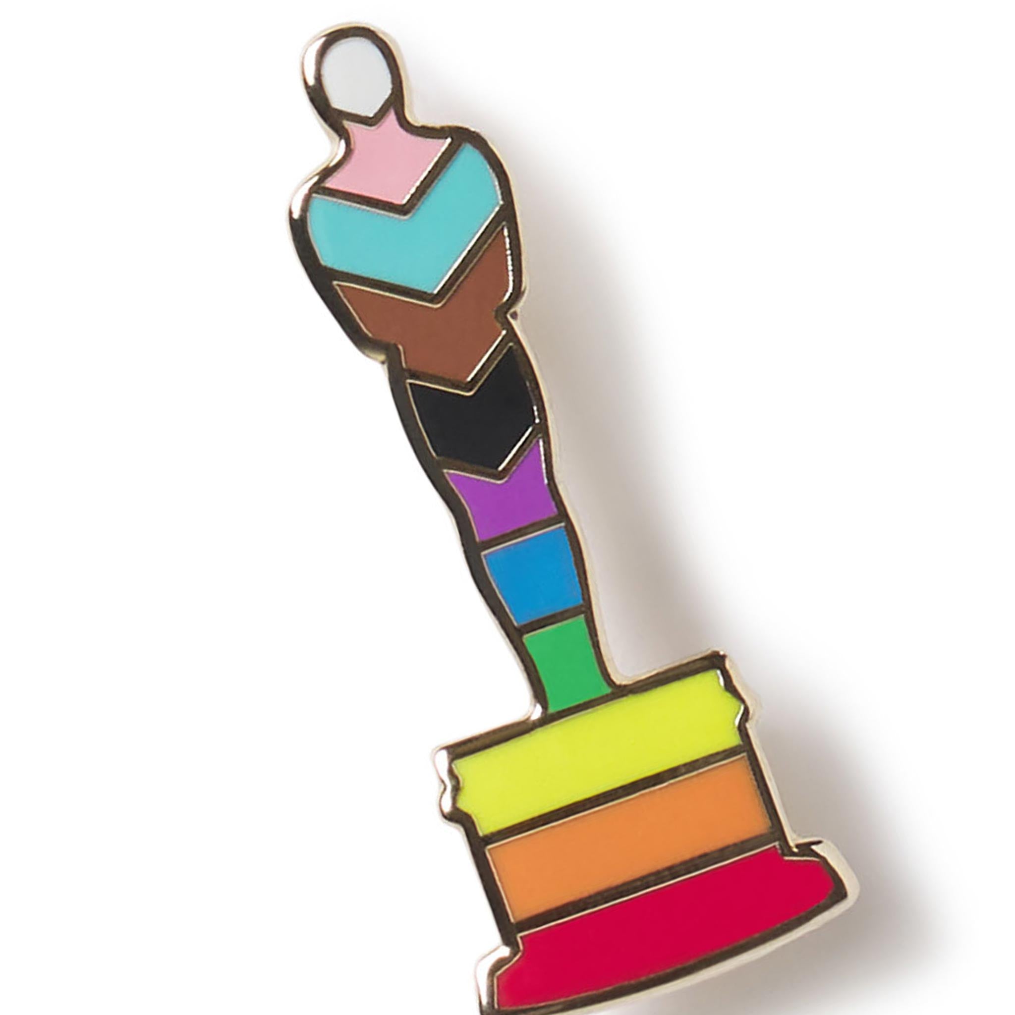 Colorful pin with a stylized figure on a white background PRIDE FLAG PRIDE COLORS OSCAR STATUETTE ACADEMY AWARDS PIN