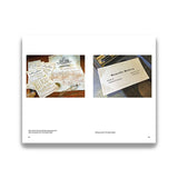 Pages from a book showing vintage documents and stationery on a white background