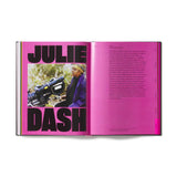 Book open to a page with 'Julie Dash' on a pink background. Academy Musseum Exhibition Catalogue