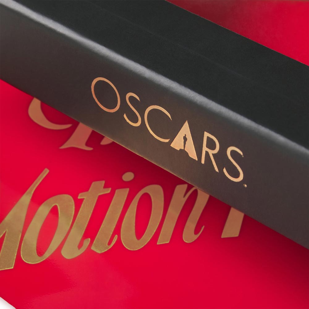 Close-up of a product with 'Oscars' branding on a red background. Academy Awards Best Picture Category Winner Ceramic Trinket Tray Dish