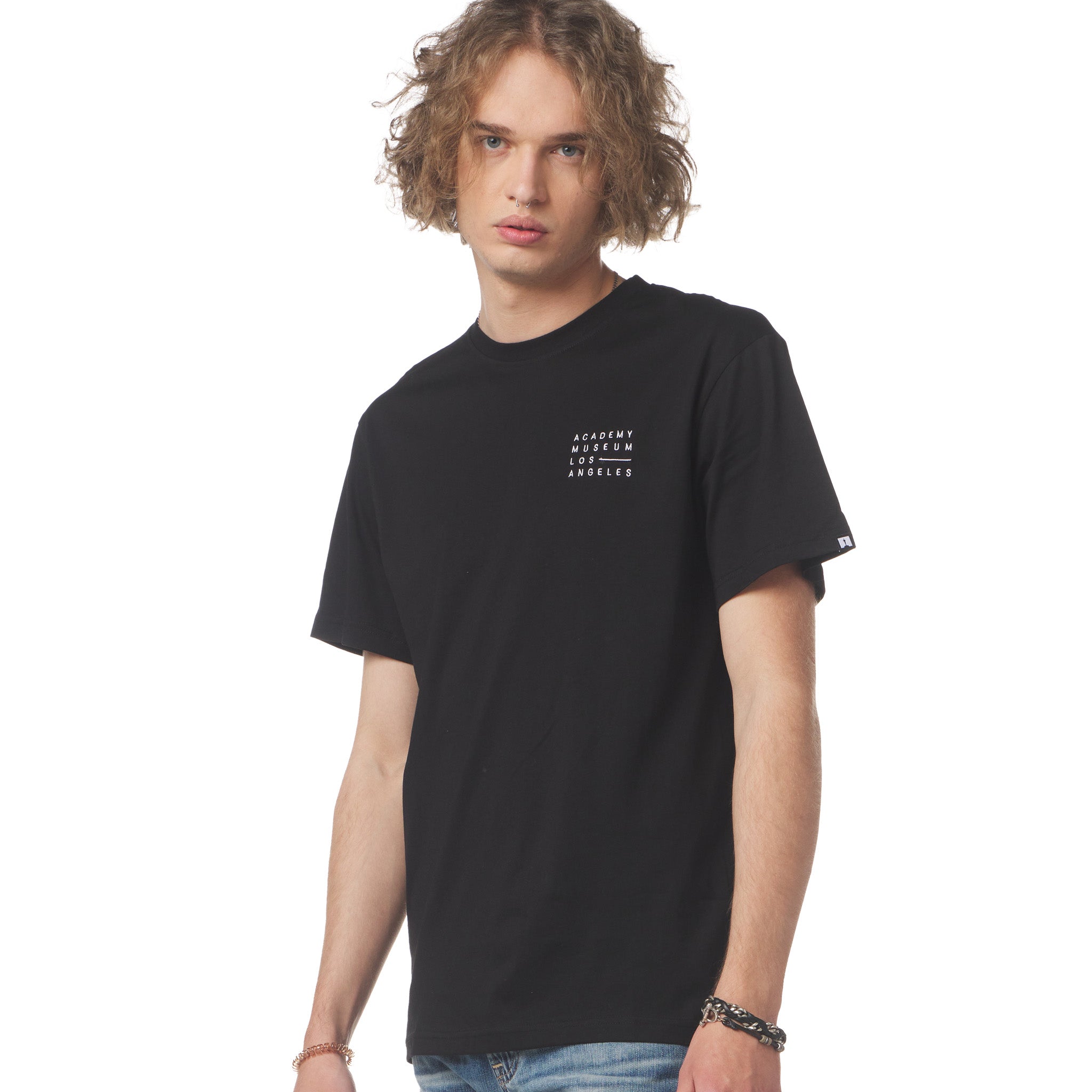Man wearing a black t-shirt with text on a white background