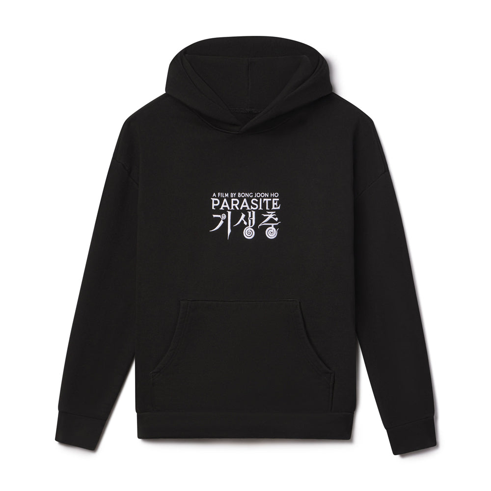 Black hoodie with white text on the back against a white background movie logo of the oscar winning film Parasite by director Bong Joon Ho.