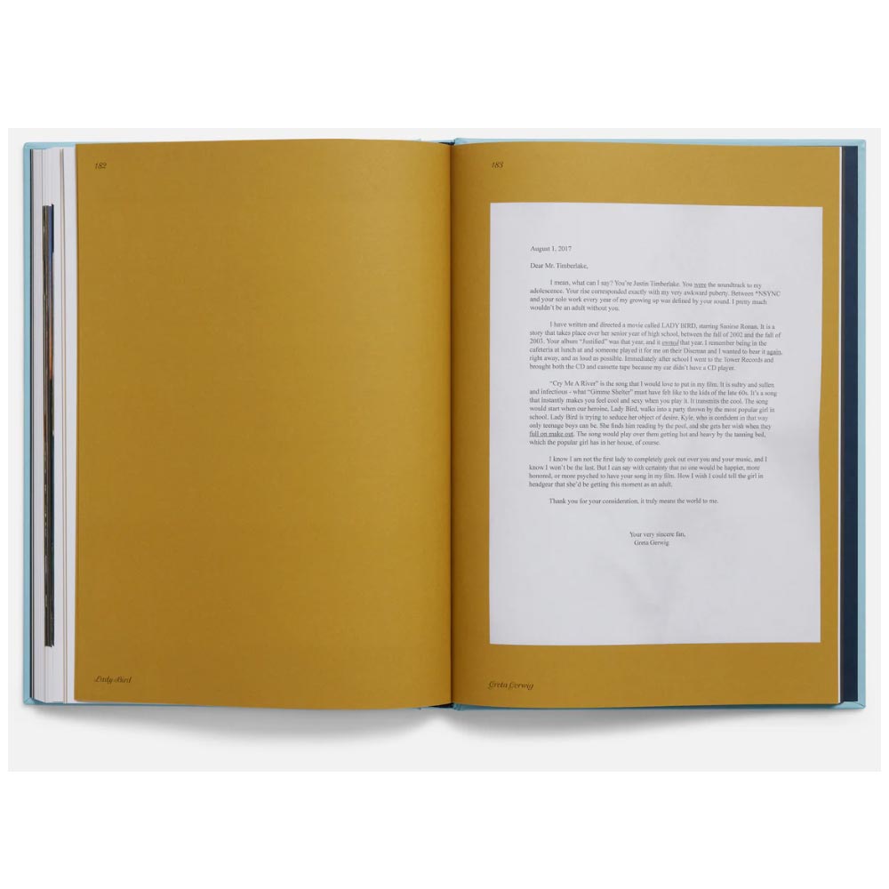 Open book with yellow pages and white text on a white background