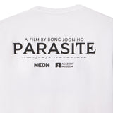White t-shirt with 'Parasite' movie text and logos on a white background featuring logo of NEON and Academy Museum