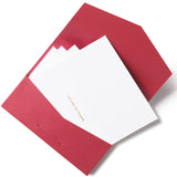 A set of red envelopes and white folded notecards with the Oscars gold logo monogram on the front.