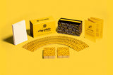 Collection of card games and packaging on a yellow background