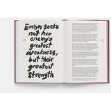 Open book with a quote on a white background
