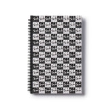 Notebook with black and white geometric pattern of The Godfather movie logo on a white background