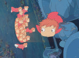 Animated character with red hair and a large blue creature in a dark underwater setting.