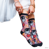 Person wearing socks with cartoon character design on a white . Elevate your fall style with the Bride of Frankenstein Shimmer Sheer Crew Sock. A perfect blend of spooky glam and comfort, featuring a kawaii design and rich colors.background