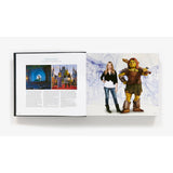 Book open to a page with Shrek and a person on a white background