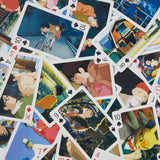 Playing cards with animated character illustrations from Studio Ghibli's kiki's delivery service on a colorful background