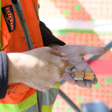 Person holding small rectangular objects with a blurred background