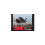Framed poster of a shark from 'Jaws' with 'Academy Museum' branding on a white background. JAWS 50th ANNIVERSARY EXCLUSIVE | ACADEMY MUSEUM GALLERY EXHIBITION.
