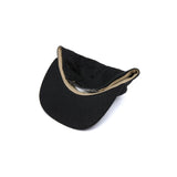 Black cap with beige interior on a white background