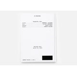 White book back cover with credits with black text on a white background