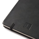 Black notebook with the Oscars logo on a white background