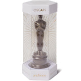Oscar statue model in a packaging box with 'Oscars' branding on a white background