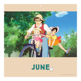 Calendar page for June with an animated scene of a family on a bicycle, featuring trees and blue sky.