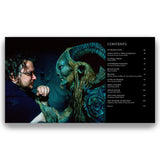 Del Torro facing a creature from the movie Pan's Labyrinth with a menu or list on the right side