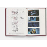 Open book with technical drawings and images on a white background from the movie Everything Everywhere All at Once