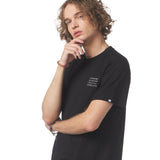 Person wearing a black t-shirt with text on a white background