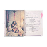 Open book with a photograph from the movie The Virgin Suicides of four women and text on a white background