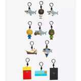 Collection of colorful keychains and tags on a white background