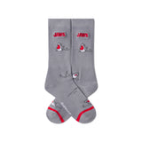 Gray socks with 'JAWS' logo and shark design on a white background