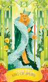Card featuring a lion-like figure wrapped in white fabric with decorative green border and 'King of Spears' text.