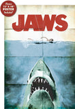 Movie poster for 'Jaws' with a shark emerging from water and a person in the background. Bonus movie poster free gift with purchase of each notebook Jaws Hardcover Journal Hardcover 50th Anniversary Edition 