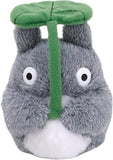 Plush toy resembling a character with a green hat on a white background