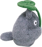 Plush toy resembling a gray creature with a green leaf on a white background