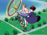 Animated characters riding a bicycle with a large egg on a green landscape Discover the magic of Studio Ghibli with Kiki's Delivery Service: 30 beautifully hand-drawn postcards celebrating Miyazaki's enchanting artistry.