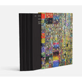 Book with a black cover and a colorful abstract design on the other side, on a white background.