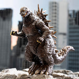  Godzilla figurine in front of a cityscape