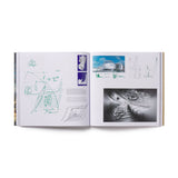 Open book showing architectural drawings and images on a white background