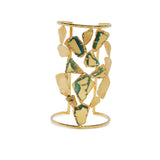 Gold bracelet with greenstone accents on a white background