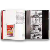 Open book with text and black and white photos on a white background
