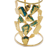 Gold and green jewelry piece on a white background