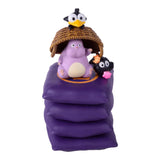 Purple character with a bird and cat on top of a purple bag against a white background
