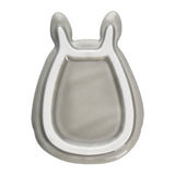 Gray ceramic Totoro-shaped dish on a white background
